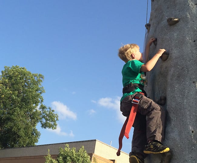 Climbing the rock wall at Frisco Festival, 30 Year of Frisco Festival