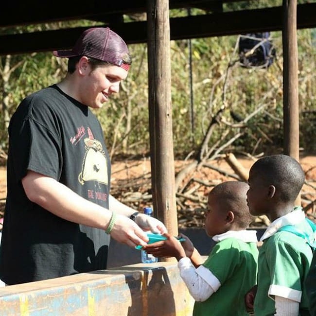 Justin serving the kids in Swaziland