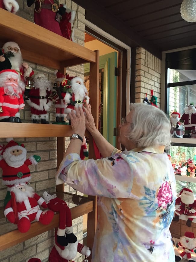 Santa Lady Fixing Santas