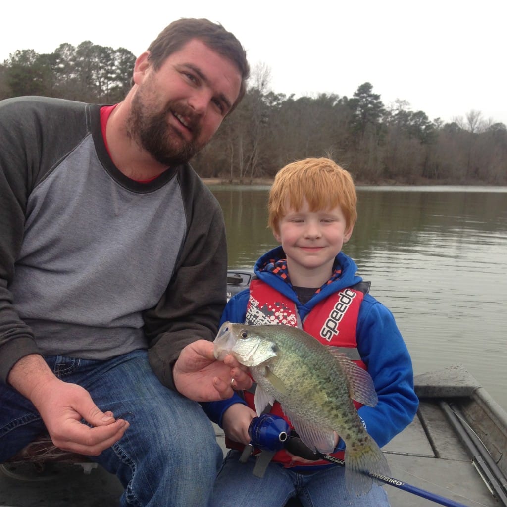 Only In Arkansas - My husband Aaron and our son Evan holding Crappie