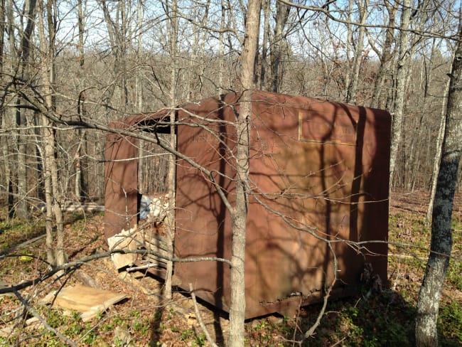 MAIL TRUCK RUSTING IN THE WOODS