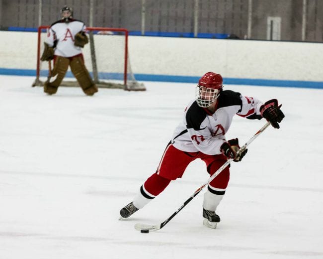 Razorback Hockey Player with puck