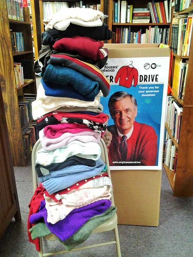 Sweaters, boxes, and books in our library (2)