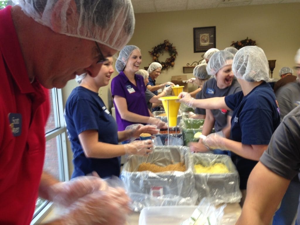 banner-photo-bridge-bash-volunteers-pack-meals